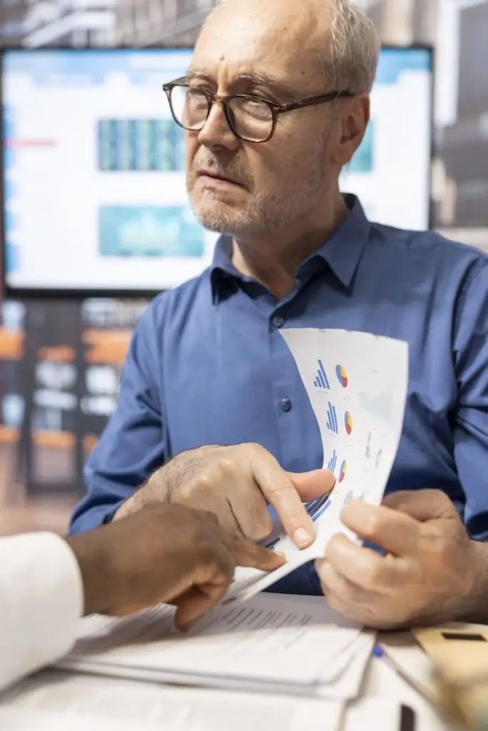 Senior Couple Discussing Variety Retirement Plans With Financial Expert 683x1024 1